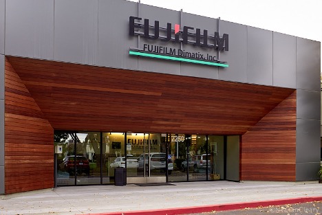 Exterior image of Fujifilm facility featuring black and red fujifilm logo